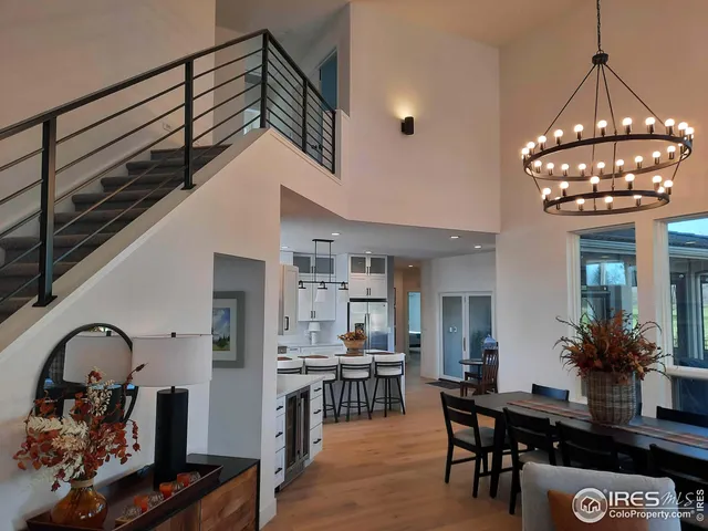 a kitchen with a dining table chairs and microwave