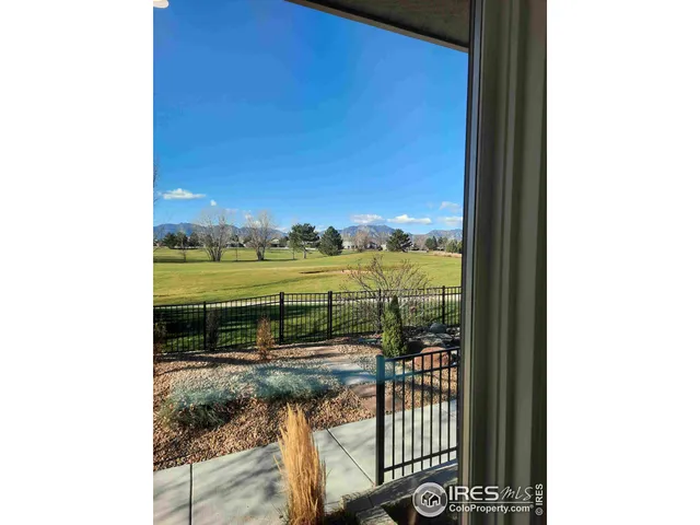 a backyard of a house with large trees