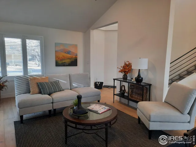 a view of a dining room with furniture wooden floor and chandelier