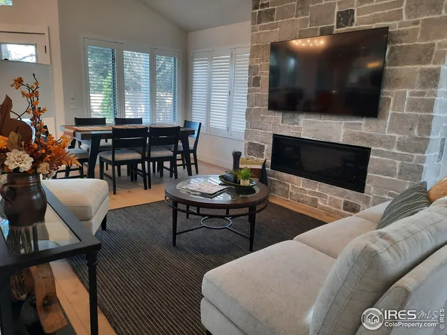 a dining room with furniture and wooden floor