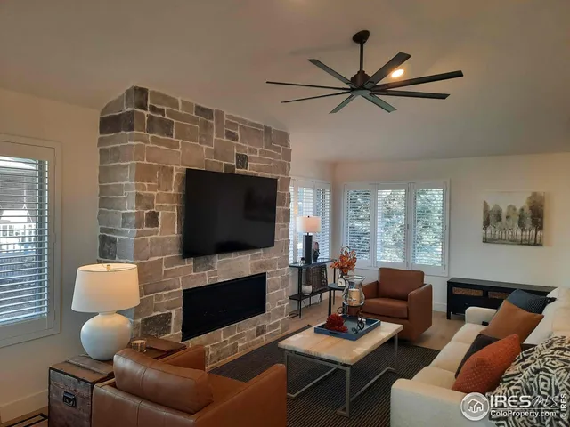 a view of a dining room with furniture and a chandelier