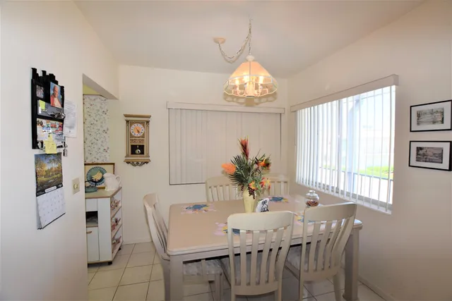 a view of a dining room with furniture and window