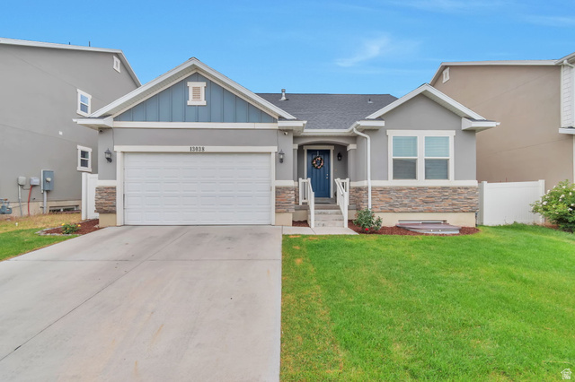 13038 Tower Ridge Drive Riverton, UT 84096 - Photo 1 of 30 Single-story residence featuring a gray stucco exterior with stone veneer accents