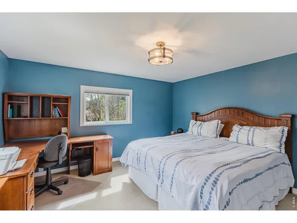 a bedroom with a bed and furniture