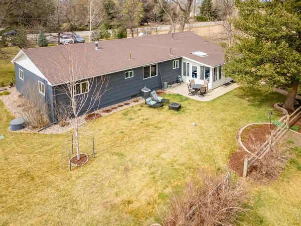 an aerial view of residential houses with yard