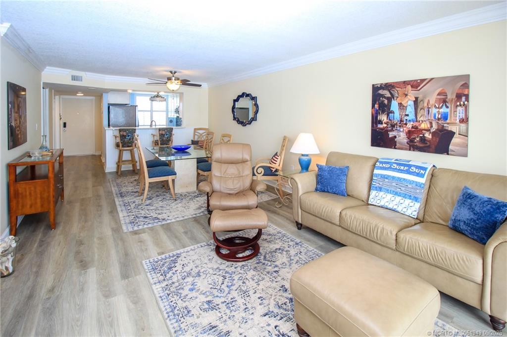 10680 South Ocean Drive, Unit 705 Jensen Beach, FL 34957 - Photo 12 of 45 a living room with furniture and wooden floor