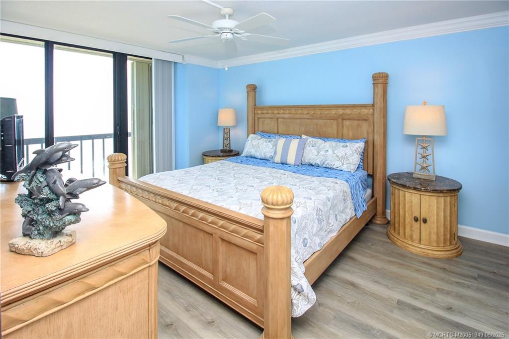 10680 South Ocean Drive, Unit 705 Jensen Beach, FL 34957 - Photo 16 of 45 a bed sitting in a spacious bedroom next to a window
