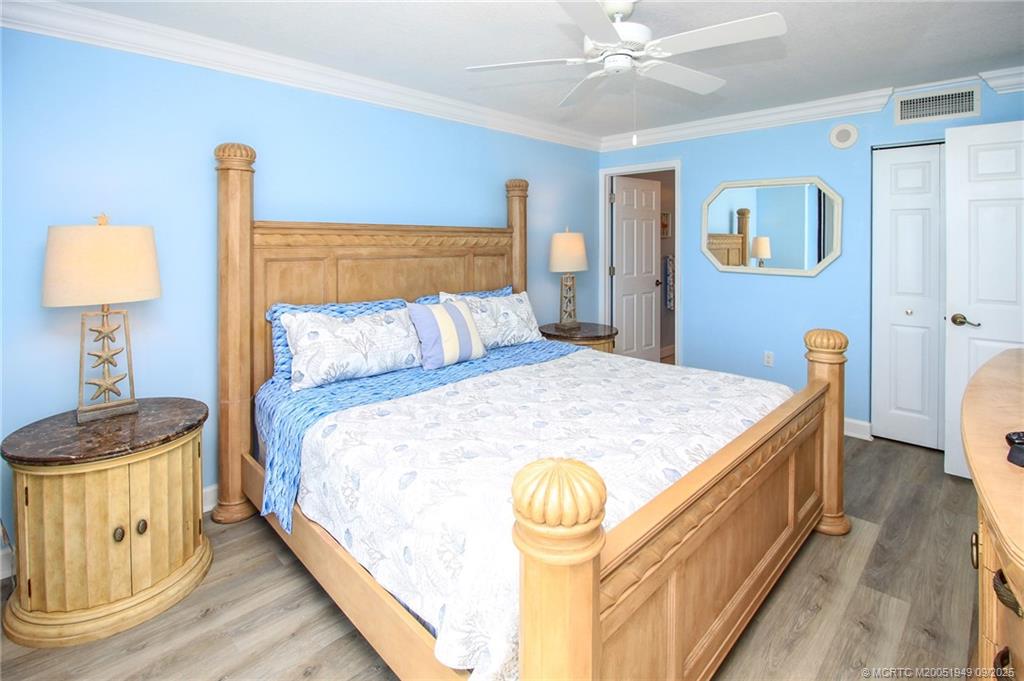 10680 South Ocean Drive, Unit 705 Jensen Beach, FL 34957 - Photo 18 of 45 a bedroom with a bed and a lamp