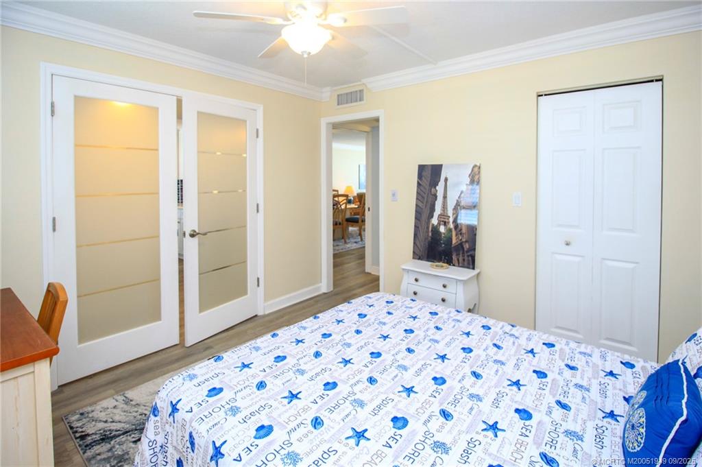 10680 South Ocean Drive, Unit 705 Jensen Beach, FL 34957 - Photo 23 of 45 a bedroom with a bed and a dresser