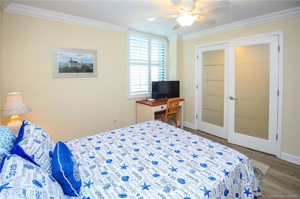 10680 South Ocean Drive, Unit 705 Jensen Beach, FL 34957 - Photo 24 of 45 a bedroom with a bed and a window