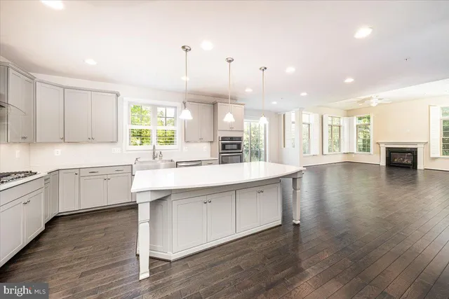 a stove top oven sitting inside of a kitchen