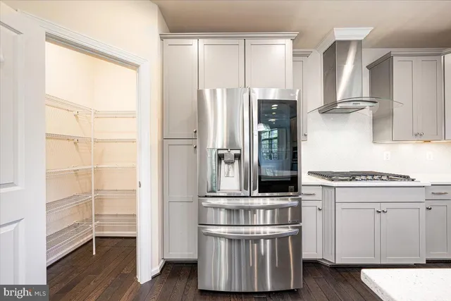 a kitchen with stainless steel appliances a sink a stove and a window