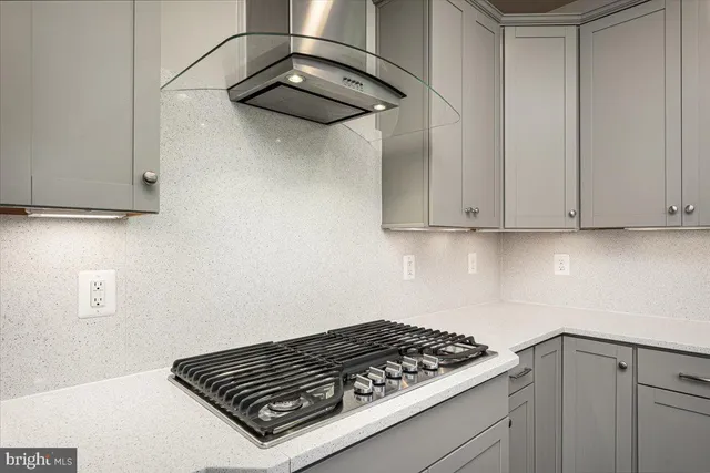 a kitchen with a sink stove and refrigerator