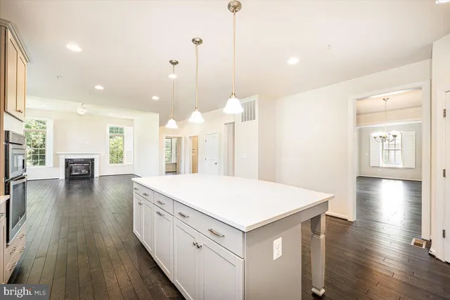 a spacious bedroom with a large bed and a couch