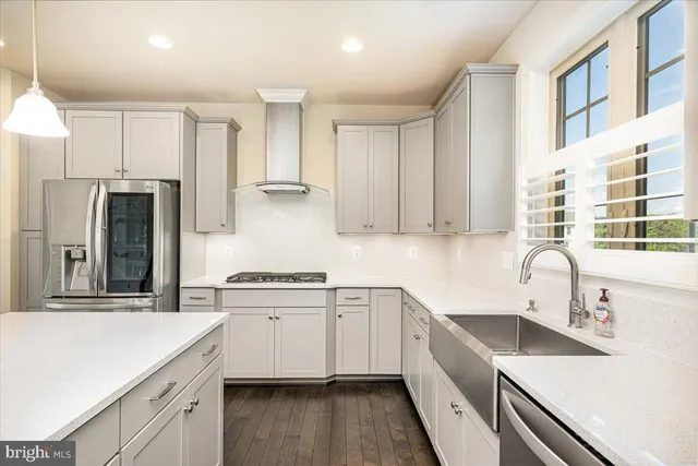 a view of empty room with wooden floor and fireplace