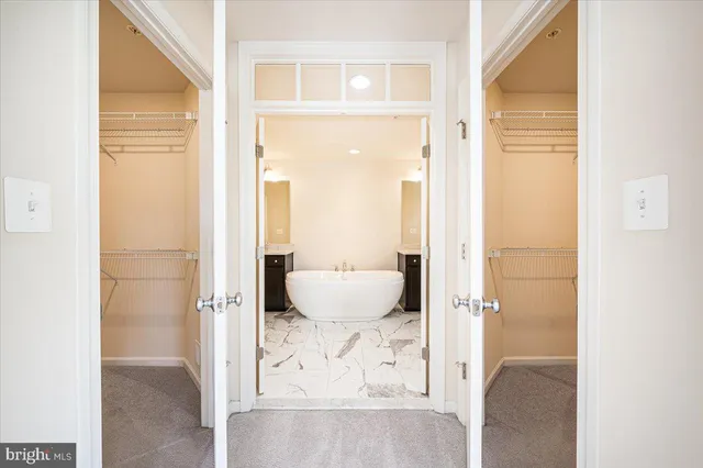 a bathroom with a sink double vanity and a mirror