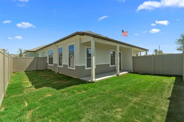 a view of a backyard of the house