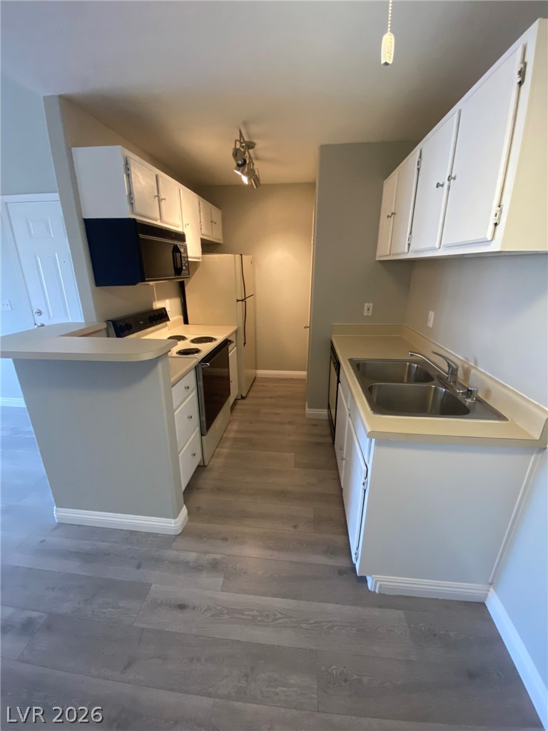 5271 South Lindell Road, Unit 202 Las Vegas, NV 89118 - Photo 11 of 27 A well-lit kitchen with ample counter space and modern appliances awaits your culinary creations.