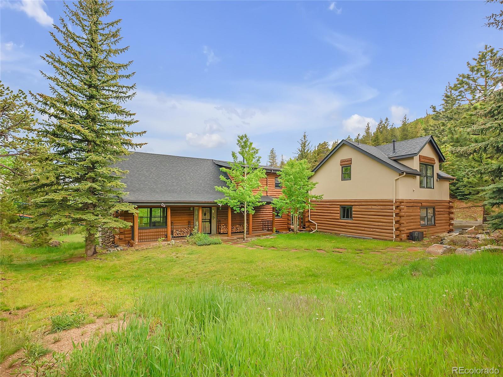 24 Pine Valley Road Evergreen, CO 80439 - Photo 1 of 50 a front view of house with yard and green space
