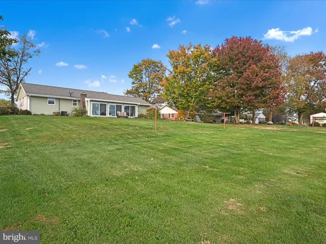 a view of a house with a big yard
