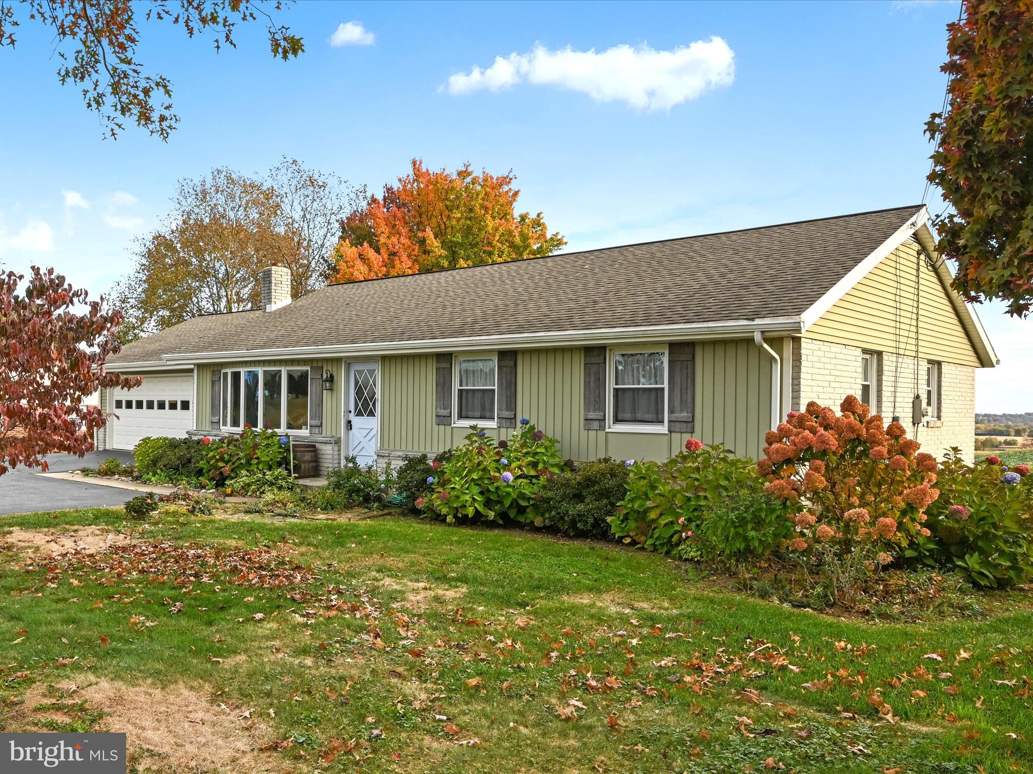 362 West Lexington Road Lititz, PA 17543 - Photo 3 of 36 a front view of a house with garden and porch
