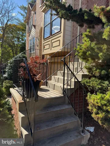 a view of staircase with wooden floor and fence