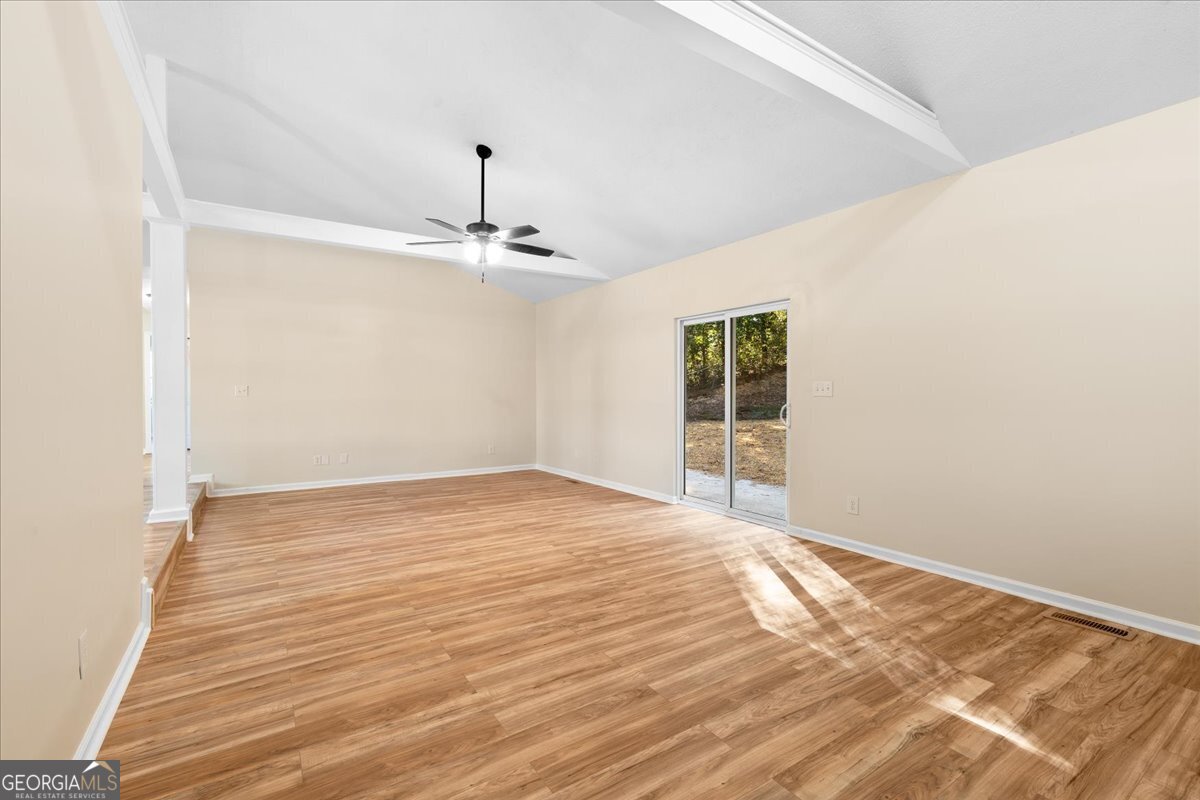 126 Waterfront Way Warner Robins, GA 31093 - Photo 17 of 60 a view of a room with wooden floor and white walls