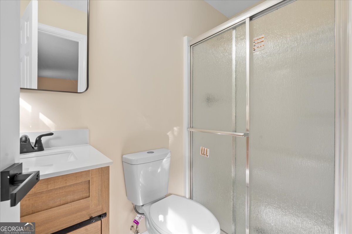 126 Waterfront Way Warner Robins, GA 31093 - Photo 26 of 60 a white toilet sitting next to a bathroom sink