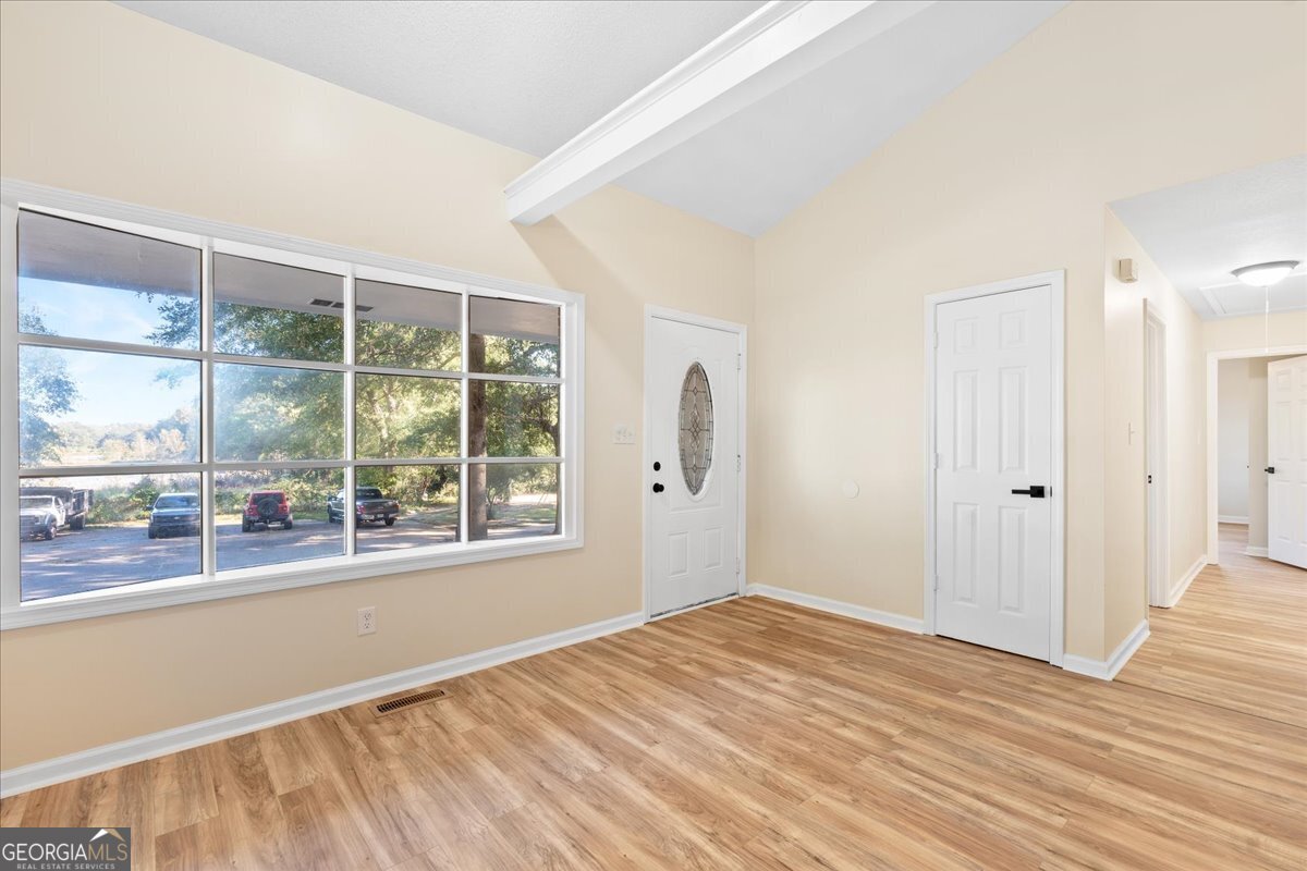 126 Waterfront Way Warner Robins, GA 31093 - Photo 31 of 60 a view of empty room with wooden floor and fan