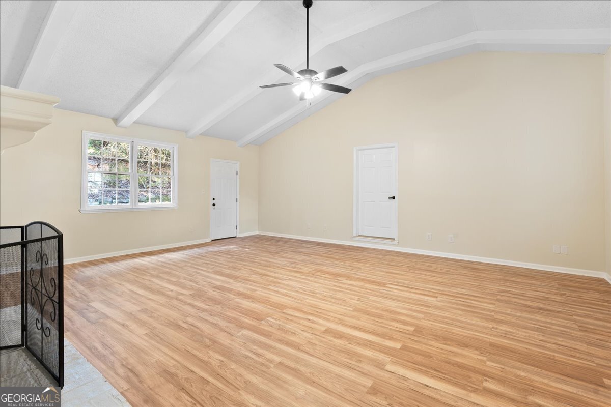 126 Waterfront Way Warner Robins, GA 31093 - Photo 41 of 60 a view of a room with window a ceiling fan and wooden floor