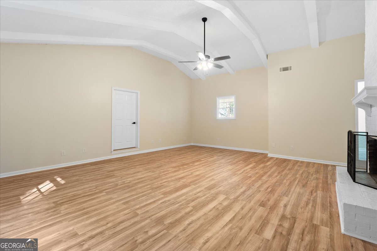 126 Waterfront Way Warner Robins, GA 31093 - Photo 46 of 60 wooden floor in an empty room with a window