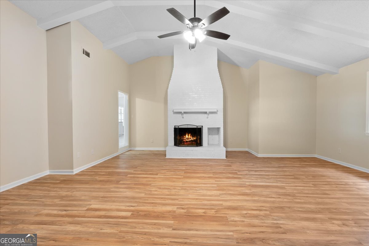 126 Waterfront Way Warner Robins, GA 31093 - Photo 47 of 60 a view of empty room with fireplace and fan