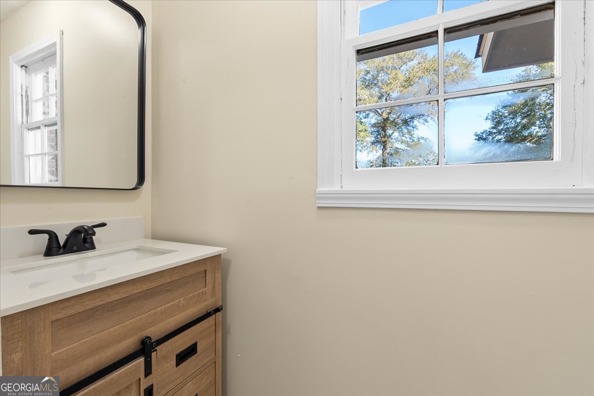 126 Waterfront Way Warner Robins, GA 31093 - Photo 54 of 60 a bathroom with a sink and a mirror