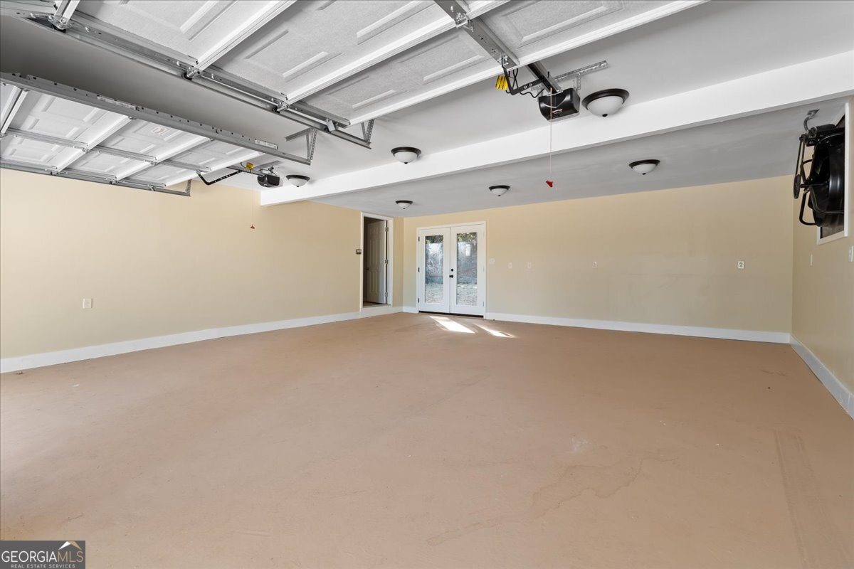 126 Waterfront Way Warner Robins, GA 31093 - Photo 56 of 60 an empty room with windows