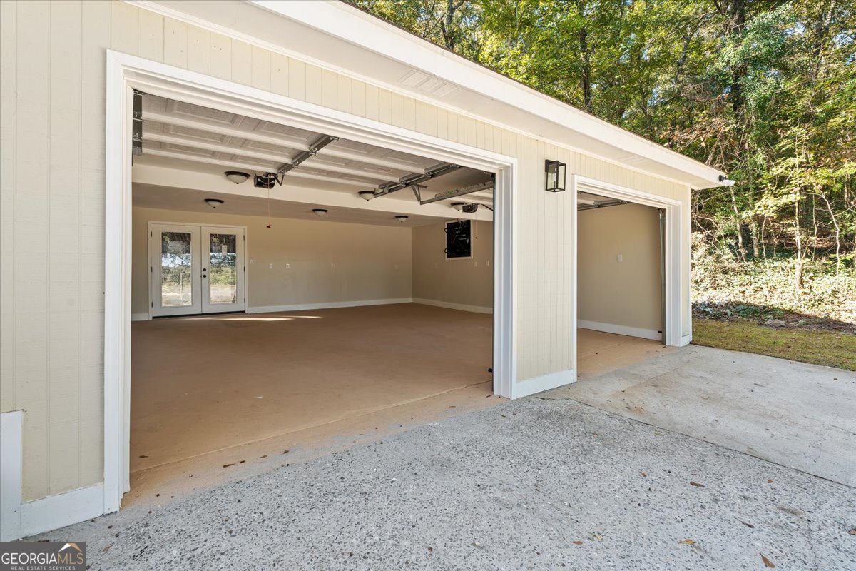 126 Waterfront Way Warner Robins, GA 31093 - Photo 57 of 60 a view of a house with a garage