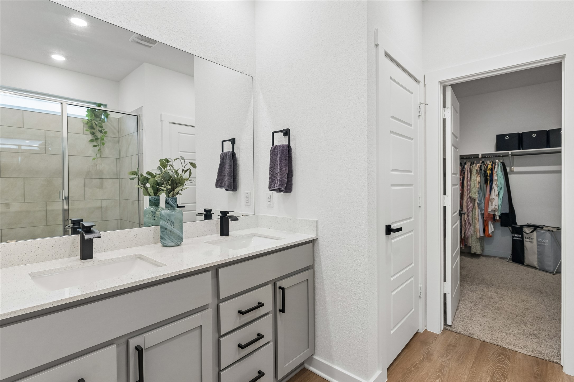 249 Century Plant Road Leander, TX 78641 - Photo 12 of 22 a bathroom with a double vanity sink a and mirror