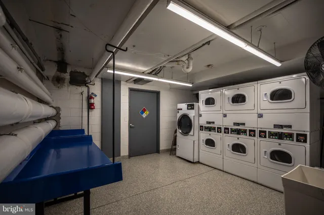 a view of a terrace with trees & benches