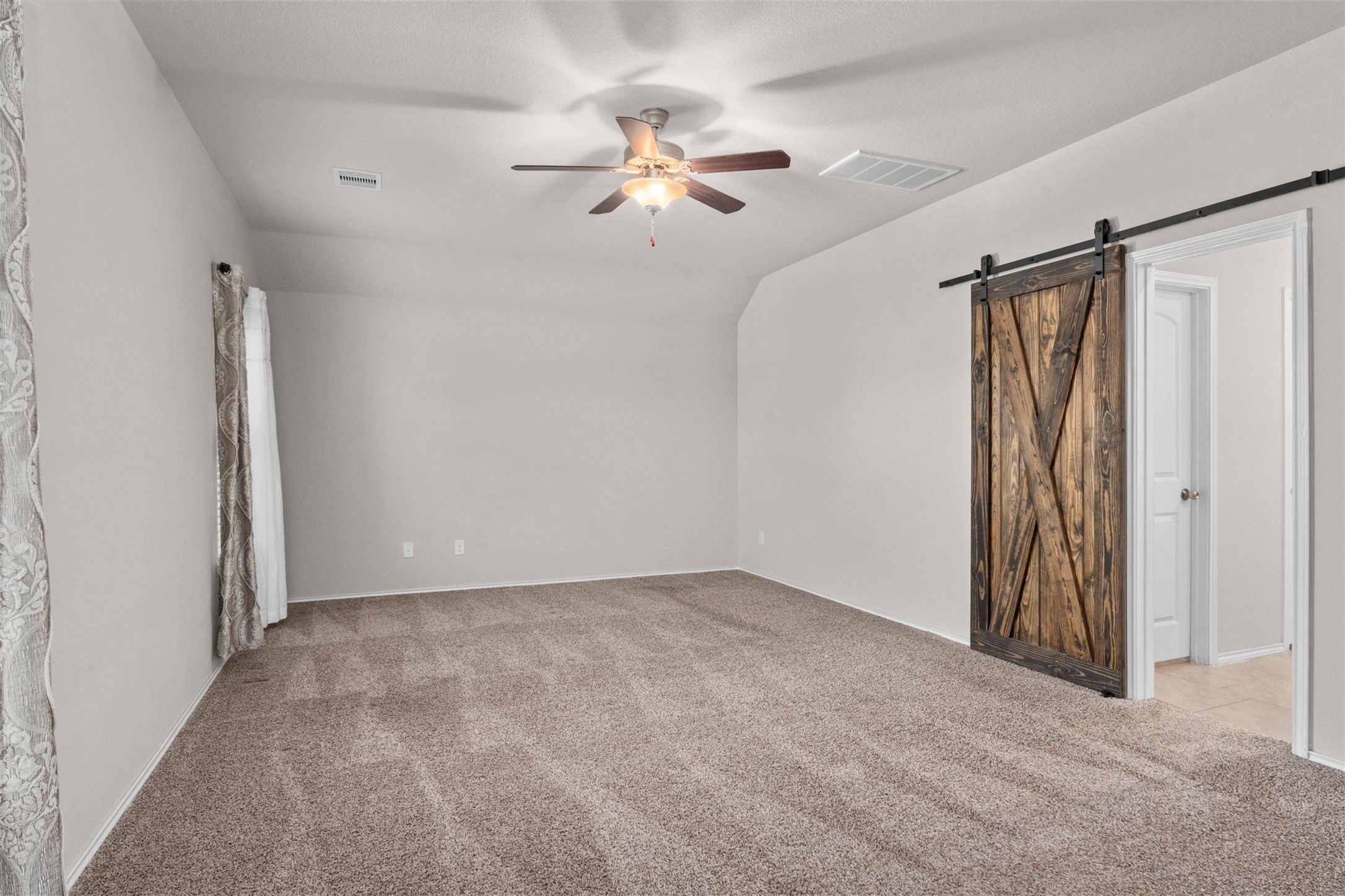 5210 Adria Hills Circle Spring, TX 77389 - Photo 17 of 42 Cute barn door to the primary bath