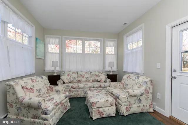 a bedroom with bed and a window