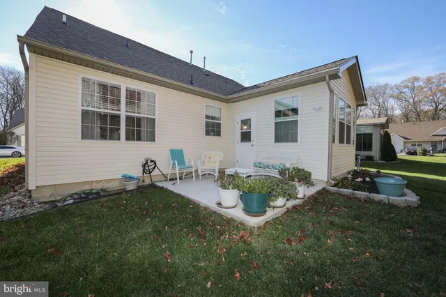 a backyard of a house with seating space