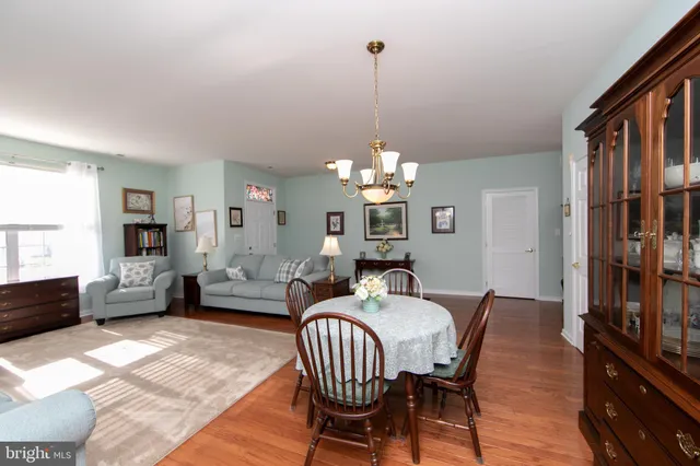 a view of a livingroom with furniture window and wooden floor