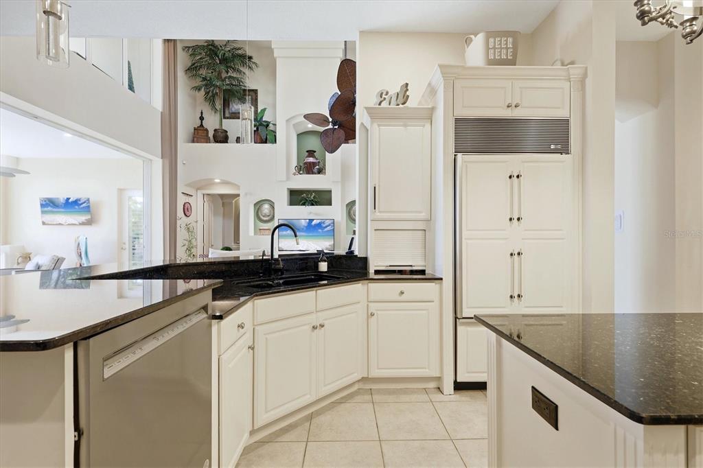 1007 3rd Street East Palmetto, FL 34221 - Photo 12 of 44 a kitchen with granite countertop a sink and cabinets