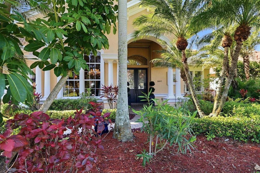 1007 3rd Street East Palmetto, FL 34221 - Photo 2 of 44 a front view of a house with a garden