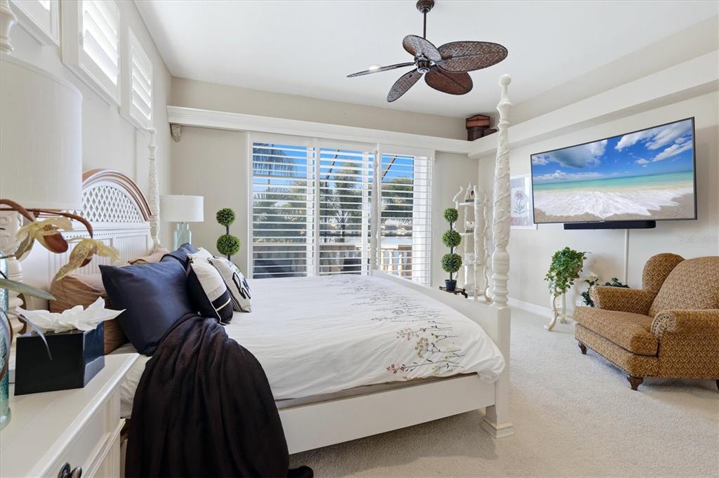 1007 3rd Street East Palmetto, FL 34221 - Photo 21 of 44 a bed room with a bed and a chair
