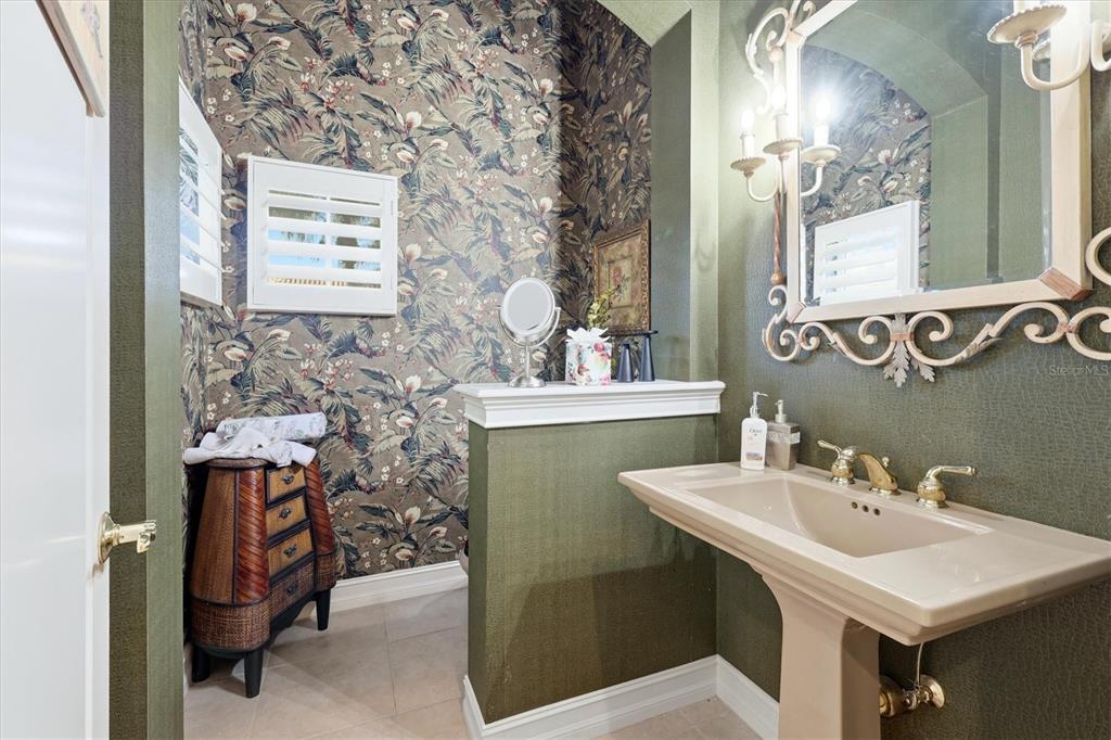 1007 3rd Street East Palmetto, FL 34221 - Photo 24 of 44 a bathroom with a sink a mirror and a toilet