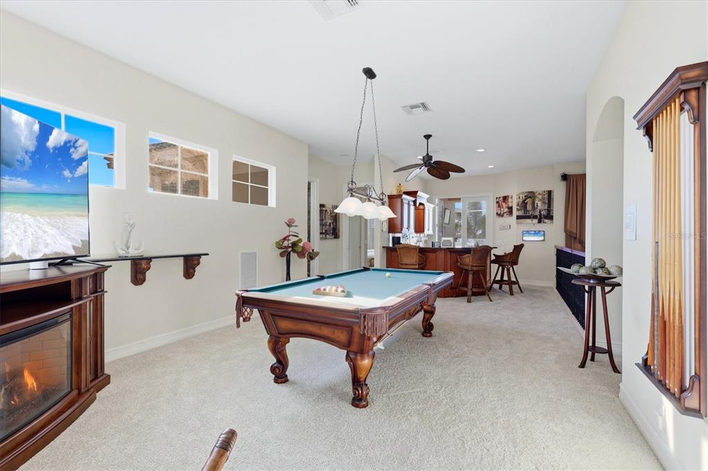 1007 3rd Street East Palmetto, FL 34221 - Photo 30 of 44 a room with furniture and a flat screen tv
