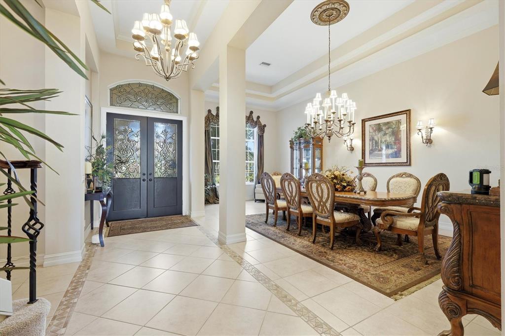 1007 3rd Street East Palmetto, FL 34221 - Photo 8 of 44 a view of a dining room with furniture and chandelier
