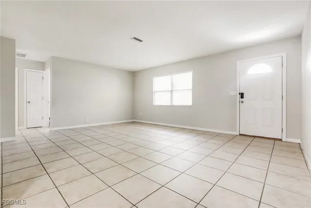 a view of an empty room and window