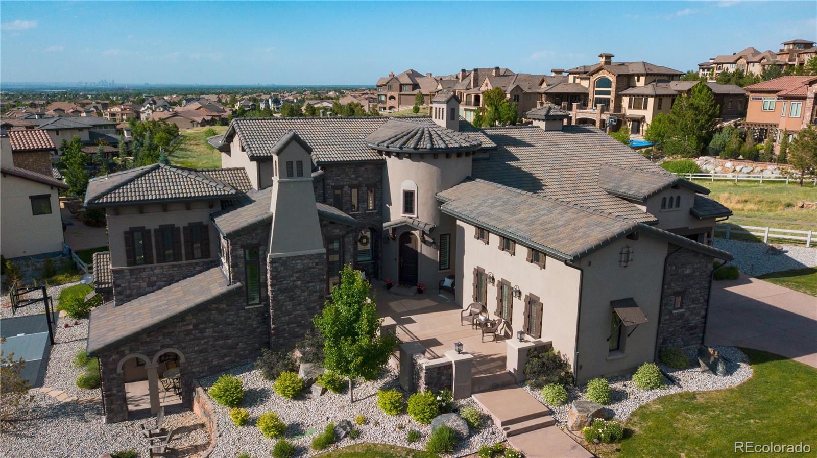 10890 Rainribbon Road Highlands Ranch, CO 80126 - Photo 1 of 40 a aerial view of a house with a yard and balcony