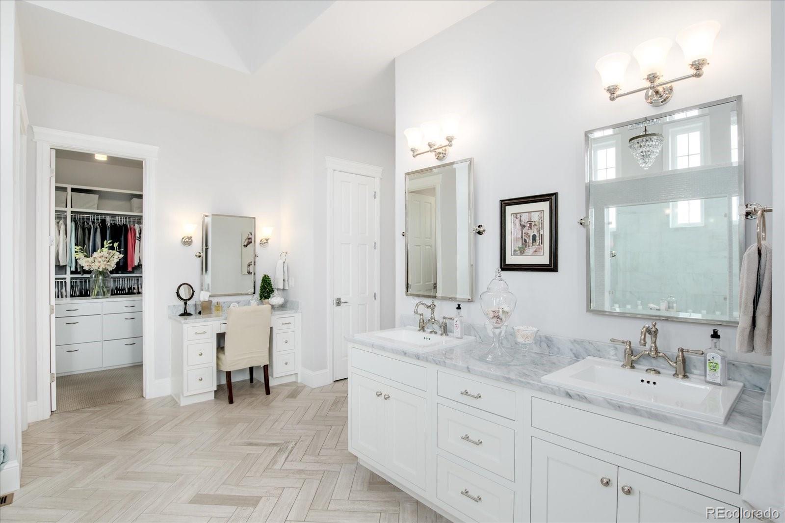 10890 Rainribbon Road Highlands Ranch, CO 80126 - Photo 21 of 40 a spacious bathroom with a granite countertop sink mirror and shower